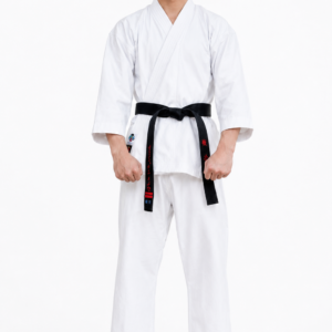 Male martial artist with a black belt standing in a natural stance, modeling the structured fit of the white Shureido Heavyweight K10 Gi