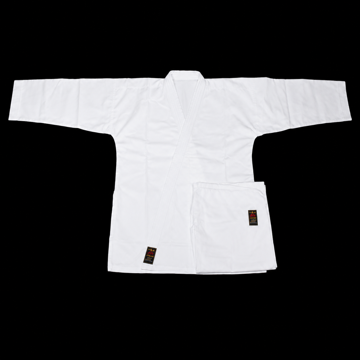 Flat lay view of the complete Shureido Heavyweight K10 Karate Gi set, featuring the crisp white jacket and folded pants.