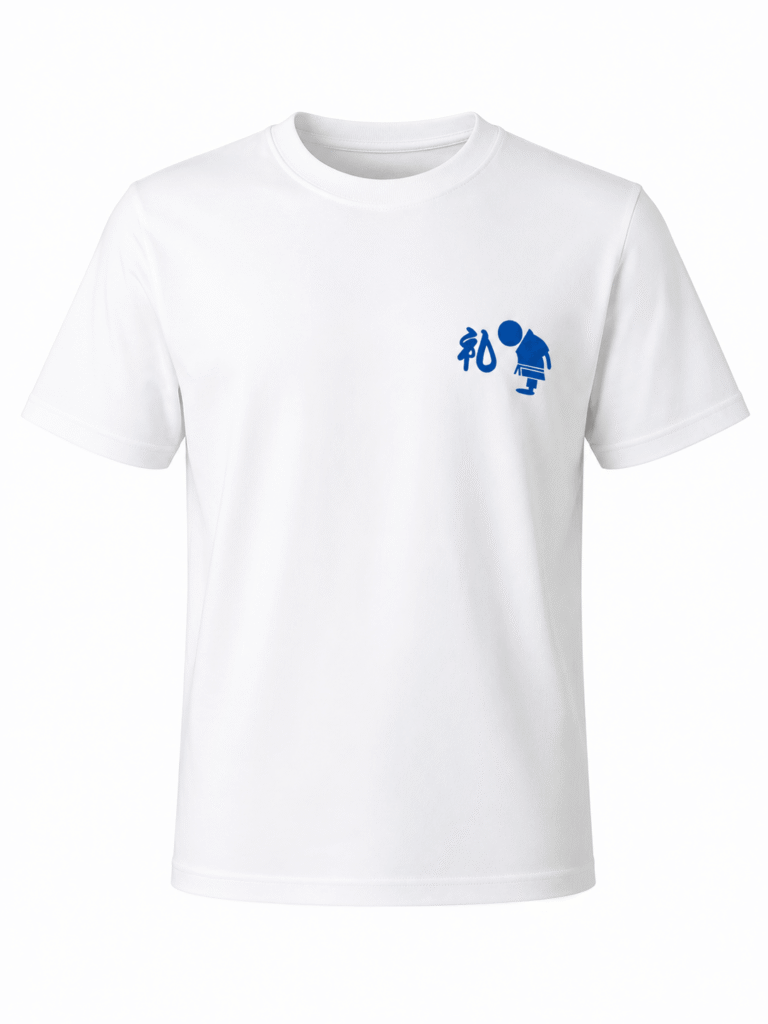 White Shureido karate t-shirt with a red Shuri-jo castle graphic and blue Shureido text logo on the front chest.